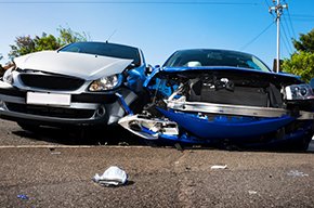 Two vehicles with front end collision damage