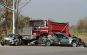 dump truck crashing through two vehicles