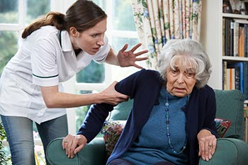 nurse verbally abusing old woman