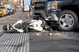 motorcycle underneath a car