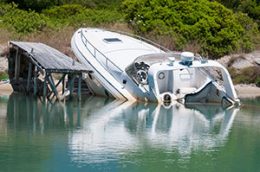 Speedboat crash into land by dock.