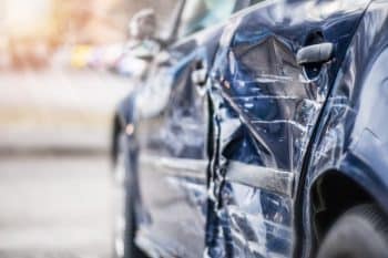 Side of car damage from an automobile accident.